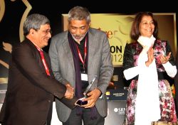 New Delhi,27 Jan 2012-IGNOU Vice-Chancellor M Aslam receiving the "Best teaching practices Award" from noted film director Prakash Jha at the India Today Aspire education summit 2012,in New Delhi on
Friday.Also in picture India Today Group's rekha Puri-IANS Photo by Amlan Paliwal