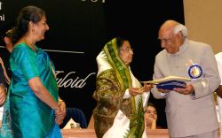 President Pratibha Devi Singh Patil presenting '' 55th National film award to Yash Chopra on behalf of her son Aditya Chopra at Vigyan Bhawan, in New Delhi on Wednesday, also in photo I and B minister Ambika Soni.