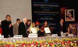 President Pratibha Devisingh Patil launching ''flexi-learning platform'' at the Silver Jubille Celebration of Indira Gandhi National Open University in New Delhi on Thursday also in photo HRD Ministers Kapil Sibal and D. Purandeswari, planning commission member Dr Narendra Jadhav and vice-chancellor V N Rajasekharan Pillai