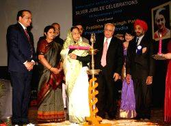 President Pratibha DeviSingh Patil lighting the lamp at the Silver Jubille Celebration of Indira Gandhi National Open University in New Delhi on Thursday also in photo HRD ministers Kapil Sibal and D. Purandeswari, planning commission member Dr Narendra Jadhav and Vice-Chancellor  V N Rajasekharan Pillai.