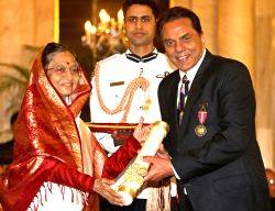 President Pratibha Devisingh Patil, presenting the Padma Bhushan Award to Dharmendra Deol, at Rashtrapati Bhavan, in New Delhi on Wednesday.