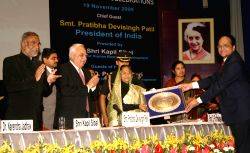 President Pratibha DeviSingh Patil receiving the mementos from Vice-Chancellor V N Rajasekharan Pilla at the Silver Jubille Celebration of Indira Gandhi National Open University in New Delhi on Thursday also in photo HRD ministers Kapil Sibal and D. Purandeswari and Planning Commission member Dr Narendra Jadhav.