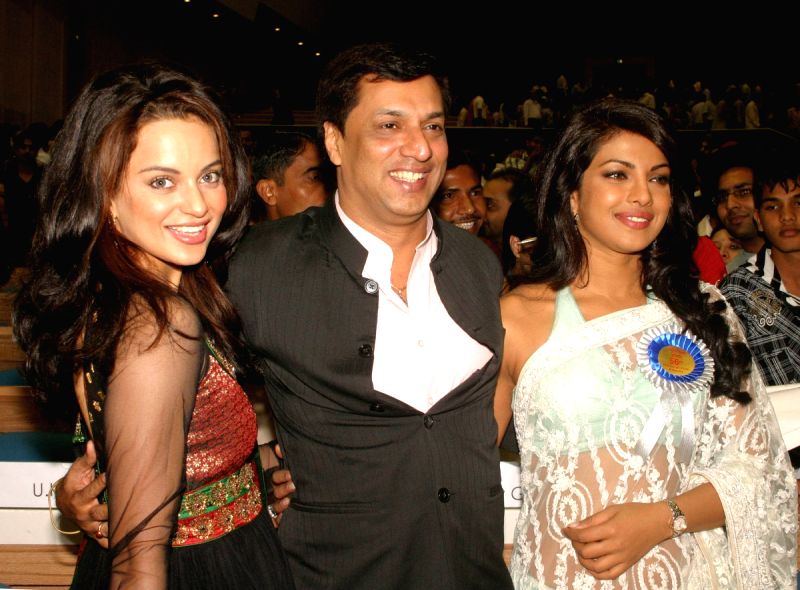 Bollywood actress Kangna Ranaut and Priyanka Chopra with director Madhur Bhandarkar at the ''56 National Film Awards'', in New Delhi on Friday.