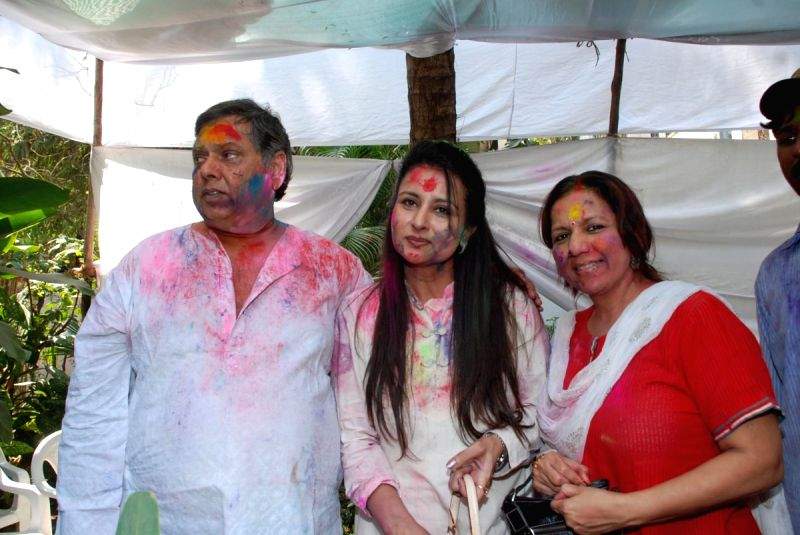 David Dhawan and Poonam Dhillon play Holi at Azmi House.