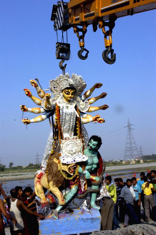 Devotees carrying the "Durga Idol" for immersion in the river Yamuna in New Delhi on Monday 28th September 2009.It marks the end of the four day long Durga puja festival mostly celebrated by the Bengali community throughout India and abroad. (Photo: Partha Sarkar, IANS)