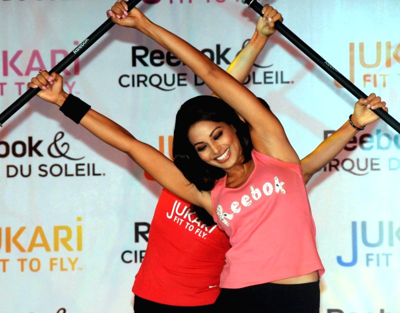 Film Actress & Brand Ambassdor Reebok Bipasha Basu shows her Fitness exercise during the launch of a new fitness work-out programme ‘Jukari Fit to Fly’ , in New Delhi on Wednesday.