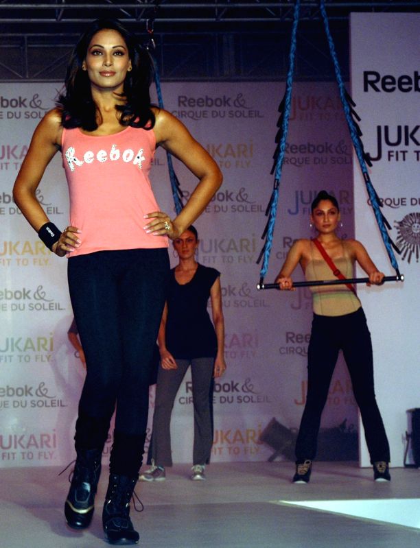 Film Actress & Brand Ambassdor Reebok Bipasha Basu shows her Fitness exercise during the launch of a new fitness work-out programme ‘Jukari Fit to Fly’ , in New Delhi on Wednesday.