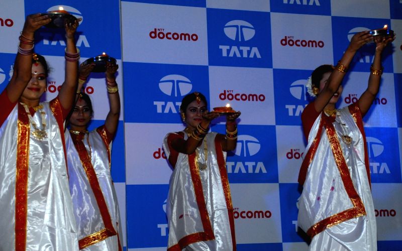 Girls with the lamp at a functation at the commercial launch TATA Docomo GSM Service in Kolkata on thursday 8th Oct 09.