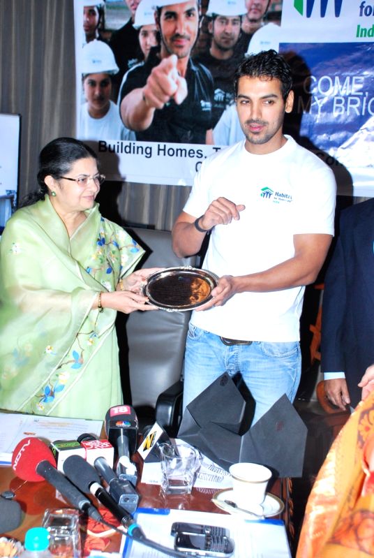 John Abraham with Rajshri Birla at “Habitat Shelter Event”.