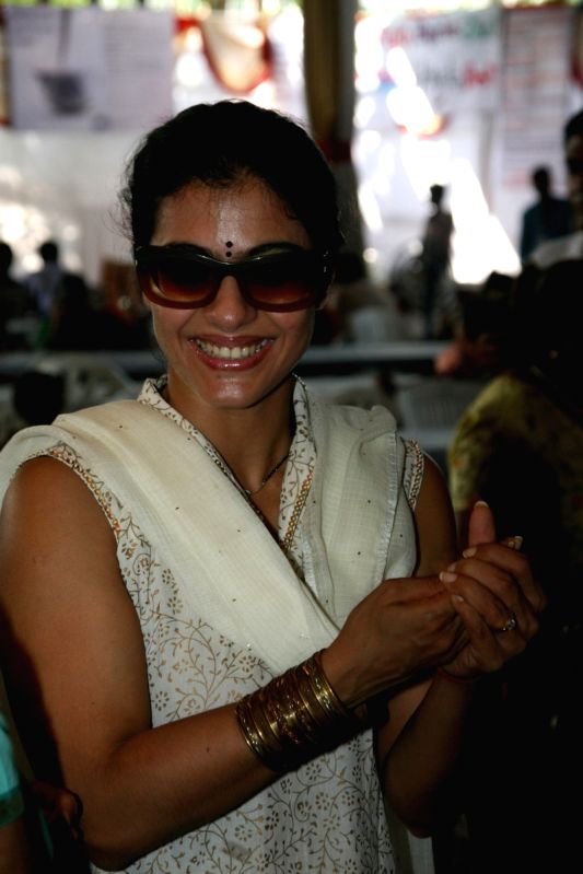 Kajol serves food to Rani Mukherjee at a Durga Pooja pandal in Mumbai.
