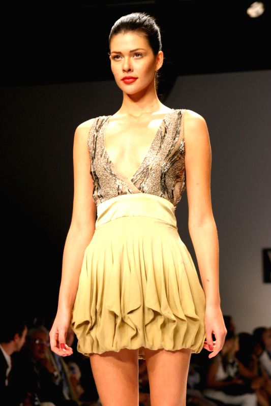 Model walk on the ramp for designer Narendra Kumar wills lifestyle India fashion week in New Delhi on Saturday.
