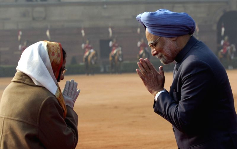 Prime Minister Manmohan Singh and President Pratibha Patil exchange greetings after the ceremonial welcome of the visiting South Korean President Lee Myung-Bak at the Rashtrapati Bhavan in New Delhi on Monday.