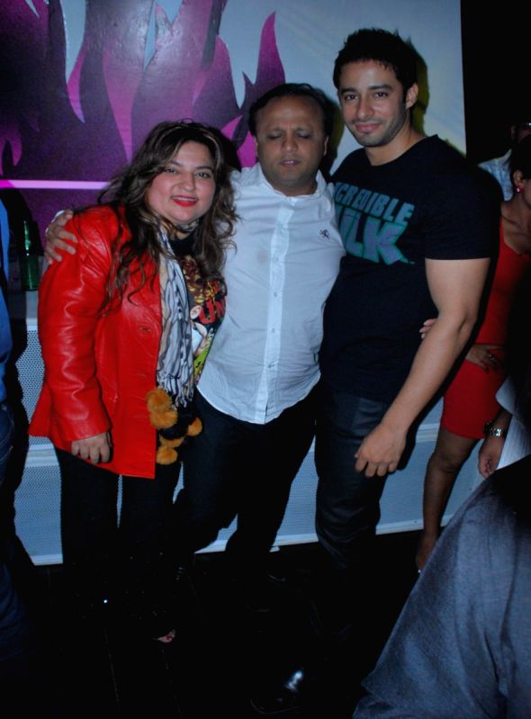 Small-screen actress Dolly and a friend with model-turned-actor Zulfi Sayed (L-R) at the Hi Lounge reopening in Mumbai.