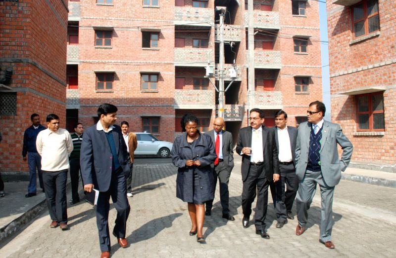 South African Deputy Housing Minister Zoliswa Kota-Fredericks (fifth from right) at a low-cost housing scheme being implemented by the Delhi State Infrastructure and Industrial Development Corporation.
