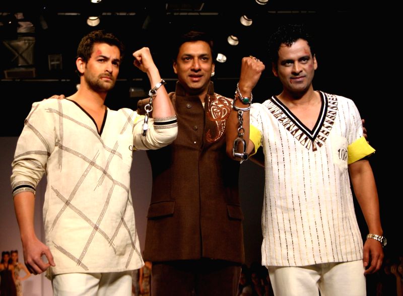 Star cast of film "Jail" Neil Nitin Mukesh and Manoj Bajpai with director Madhur Bhandarkar at the designer Reynu Tondon's show at the Wills Lifestyle India Fashion Week.
