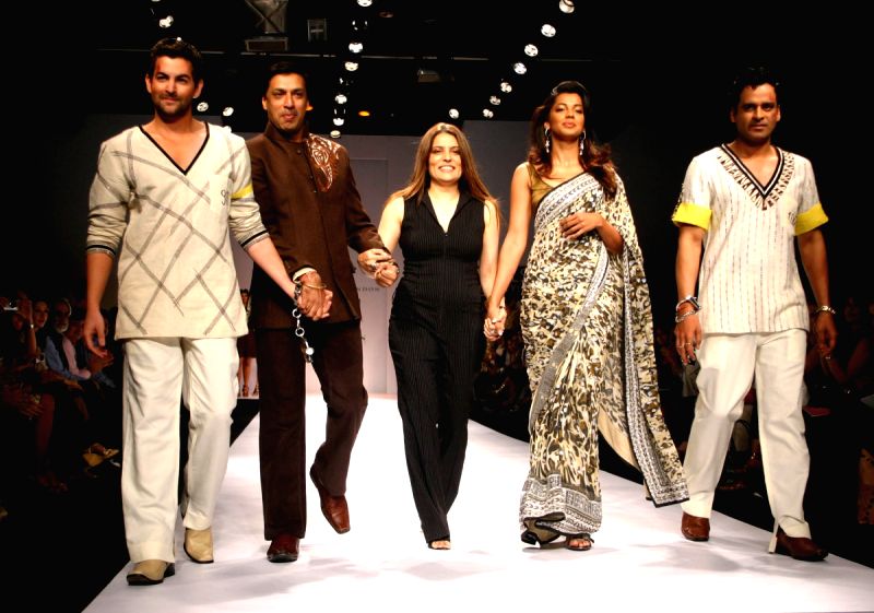 Star cast of film "Jail" Neil Nitin Mukesh and Manoj Bajpai with director Madhur Bhandarkar at the designer Reynu Tondon's show at the Wills Lifestyle India Fashion Week.