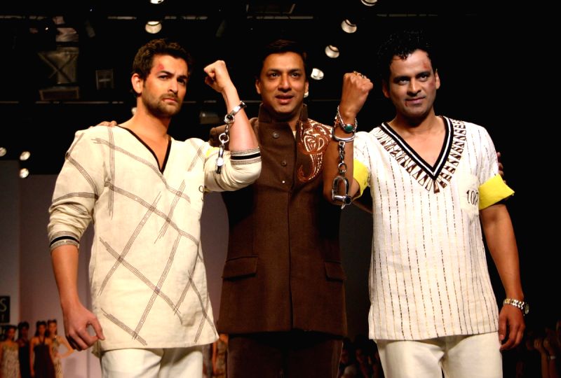 Star cast of film "Jail" Neil Nitin Mukesh and Manoj Bajpai with director Madhur Bhandarkar at the designer Reynu Tondon's show at the Wills Lifestyle India Fashion Week.