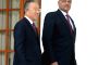 Chinese State Councilor Dai Bingguo, left, arrives to pose along with Indian National Security Adviser Shivshankar Menon in between the 15th Round of India-China Special Representatives Talks at...