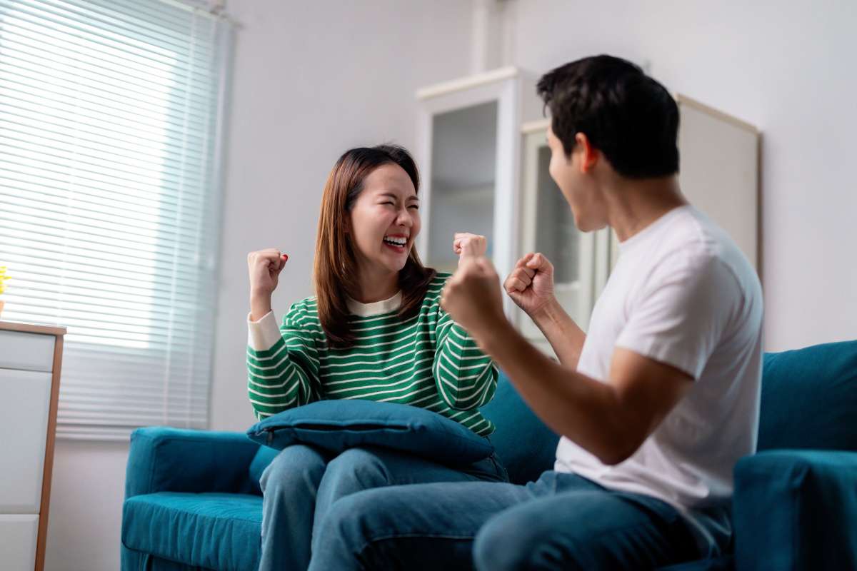 Excited Couple Celebrates Together