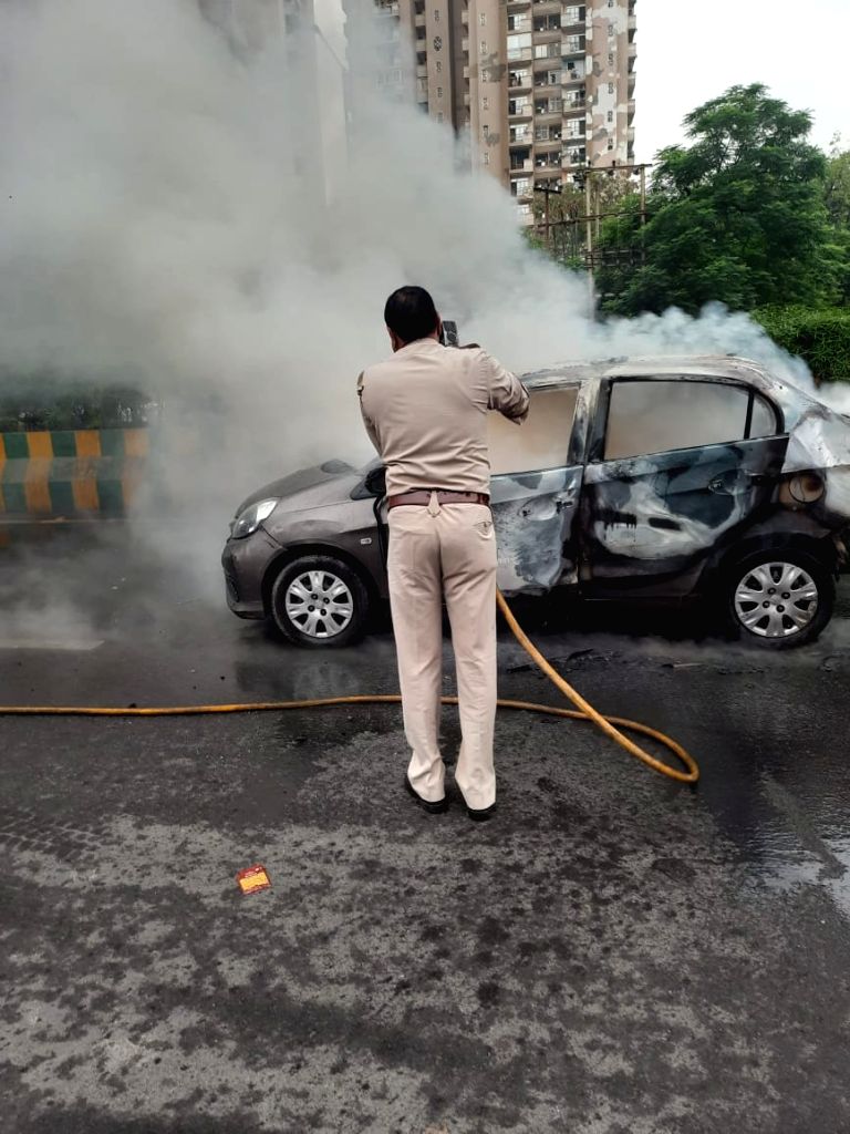 Free photo : A fierce fire broke out in a moving car, a young man and a ...