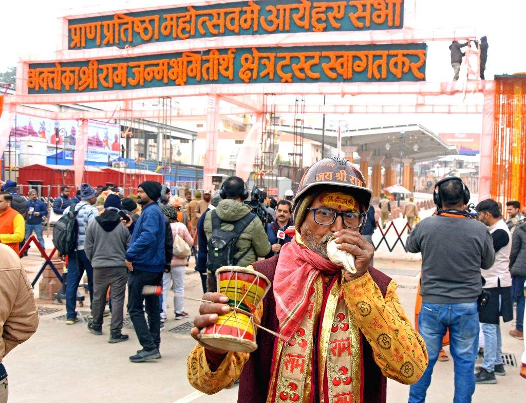 A Hindu devotee blows the 'Shankha' ahead of the Ram temple ...