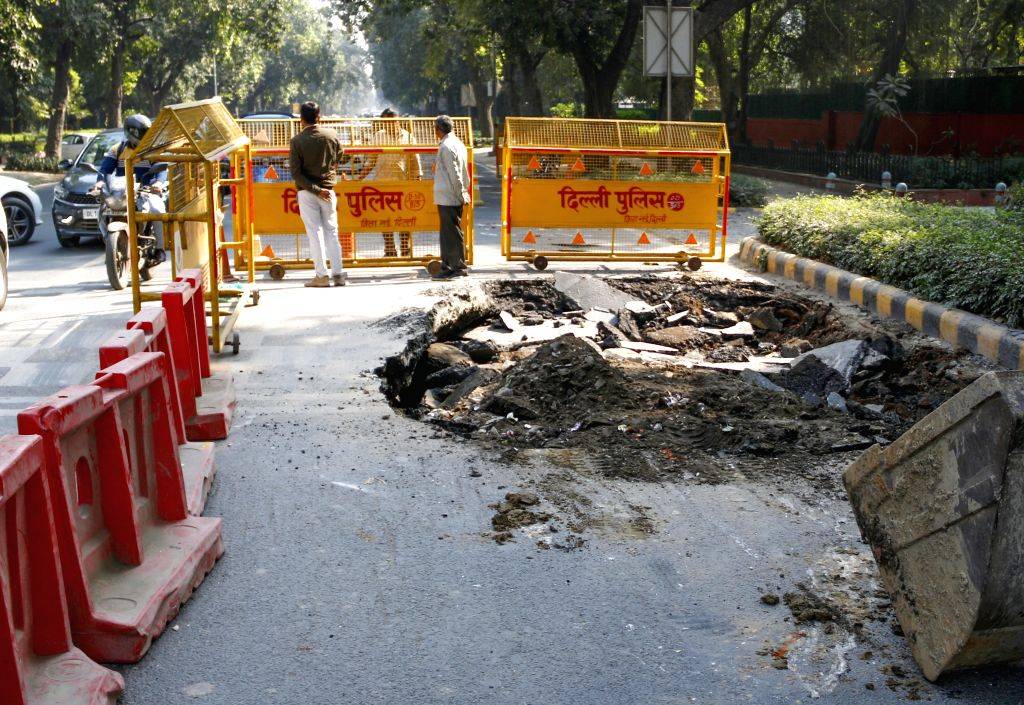 A portion of the road caved in at Ashoka Road near Le Meridien Hotel