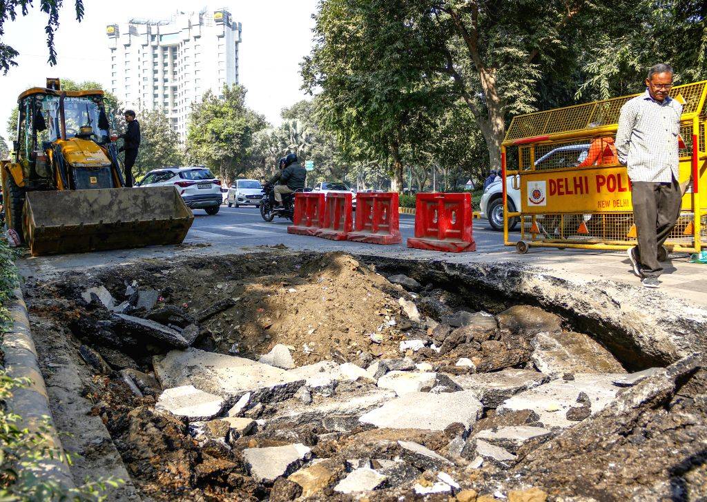 A portion of the road caved in at Ashoka Road near Le Meridien Hotel