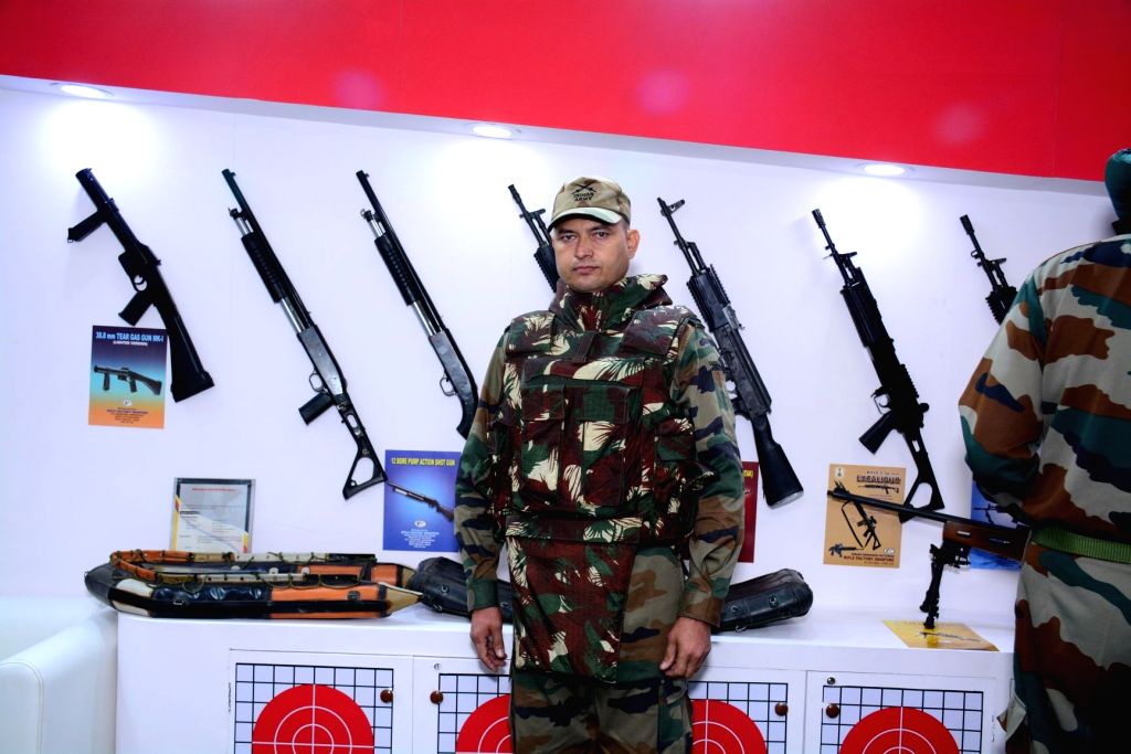A security personnel wears India's Lightest Bullet Proof Jacket ,Bhabha Kavach, that was launched by Ordnance Factory Board at the International Police Expo 2019, at Pragati Maidan in New ...