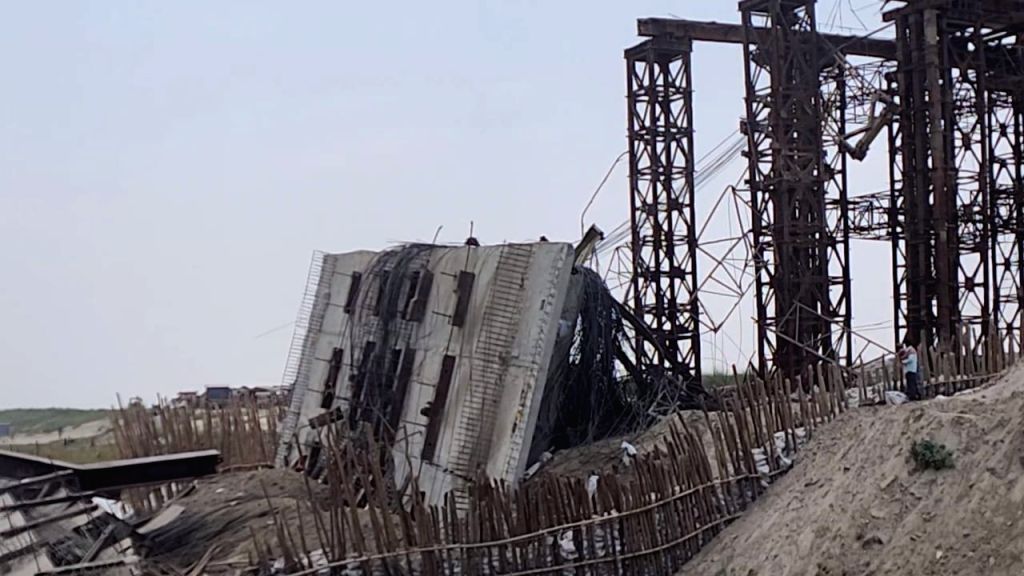 A view of an under-construction bridge which collapsed into the River Ganga