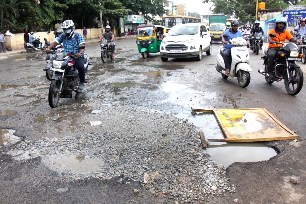 A view of the potholes on the road causing major inconvenience to people