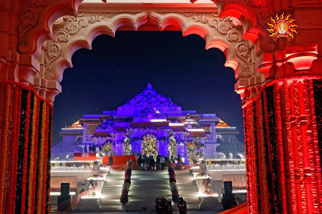 A view of the Ram Temple lit up with lights ahead of its consecration ...