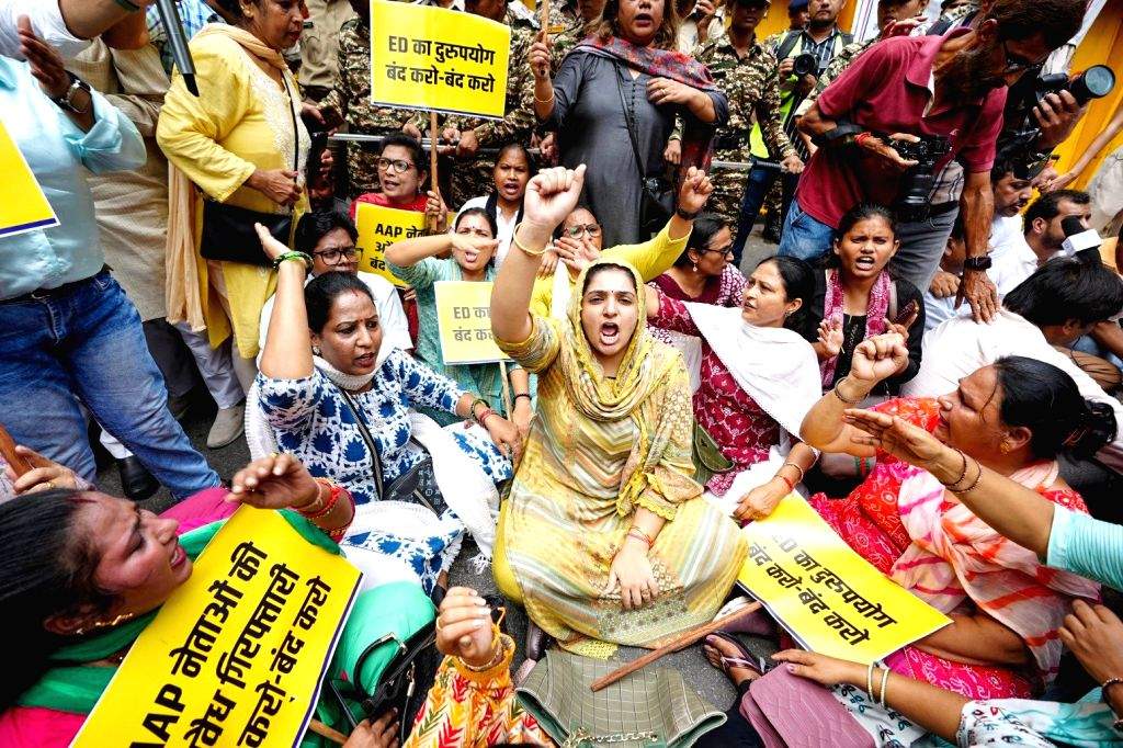 Aam Aadmi Party workers stage a protest against the alleged arrest of ...
