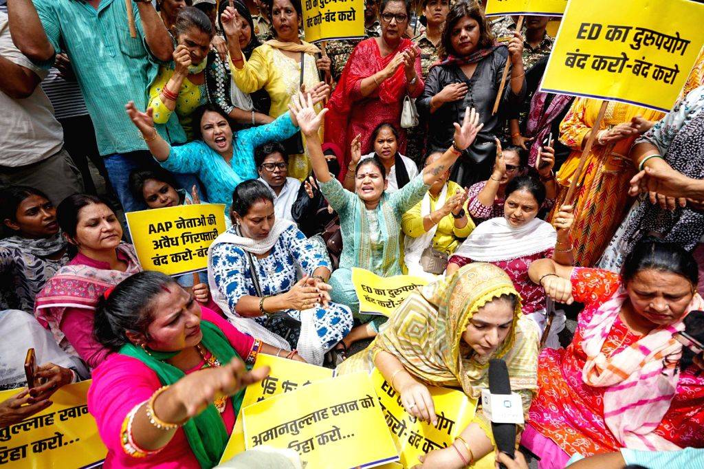 Aam Aadmi Party workers stage a protest against the alleged arrest of ...