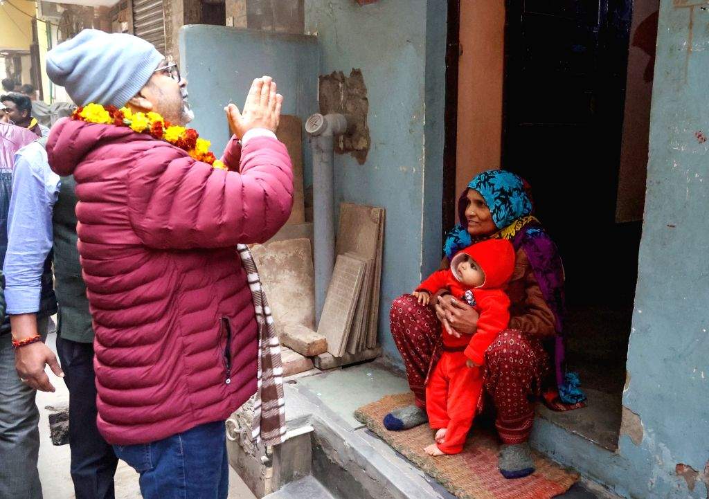 AAP candidate Awadh Ojha conducts door-to-door campaigning at Mandawali