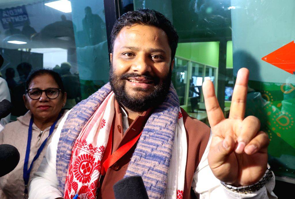 AAP candidate Kuldeep Kumar celebrates after his win in the Delhi Elections