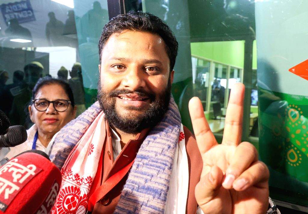 AAP candidate Kuldeep Kumar celebrates after his win in the Delhi Elections