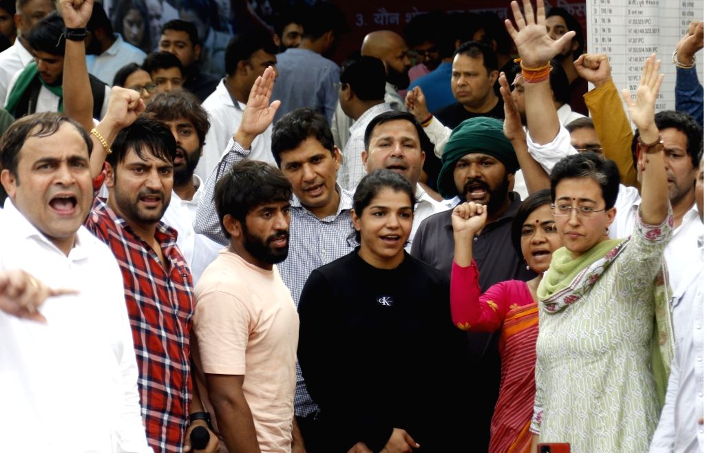 AAP leaders Saurabh Bhardwaj and Atishi and singer Ajay Hooda with ...