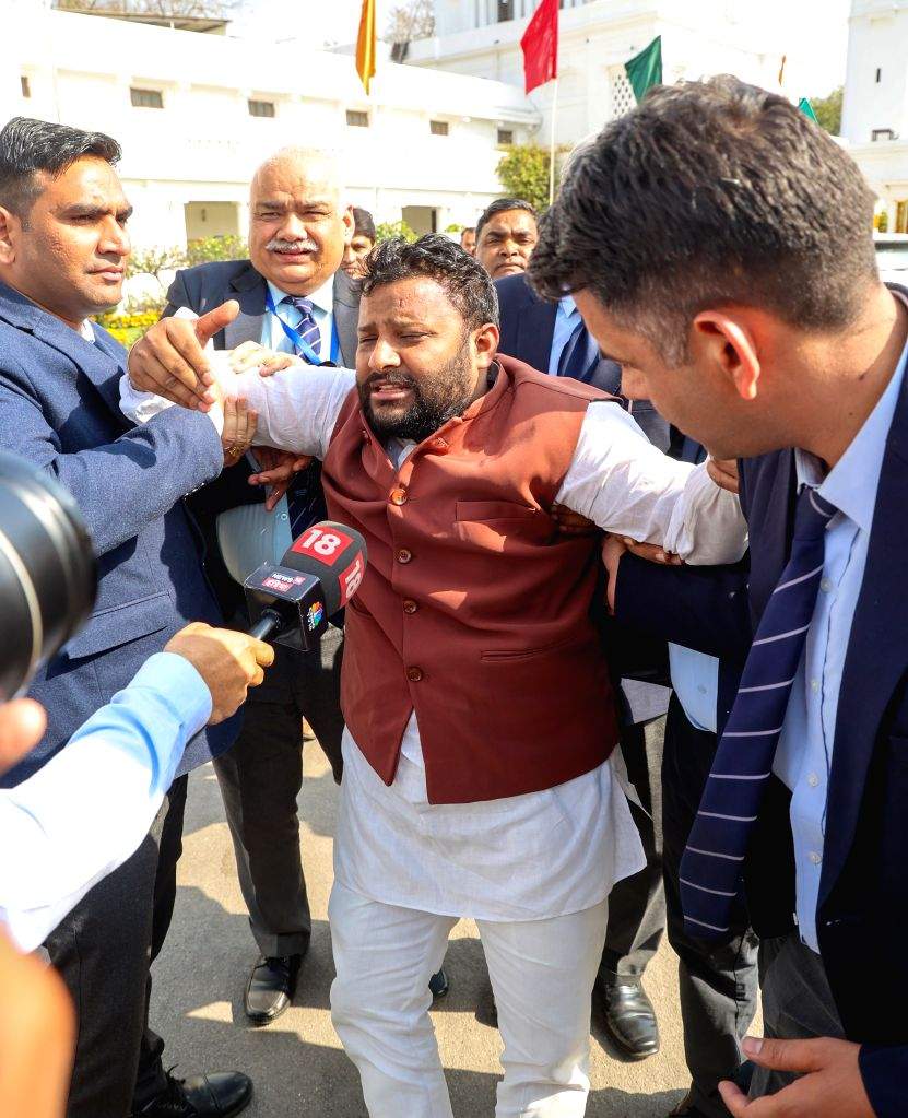 AAP MLA Kuldeep Kumar being marshalled out of Delhi Vidhan Sabha