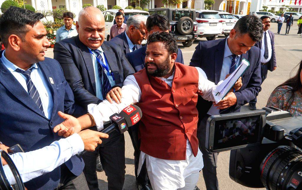 AAP MLA Kuldeep Kumar being marshalled out of Delhi Vidhan Sabha