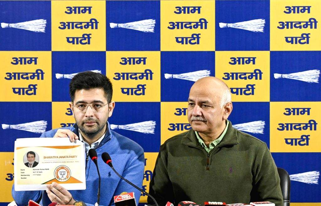 AAP MP Raghav Chadha and former Delhi CM Manish Sisodia address a press ...