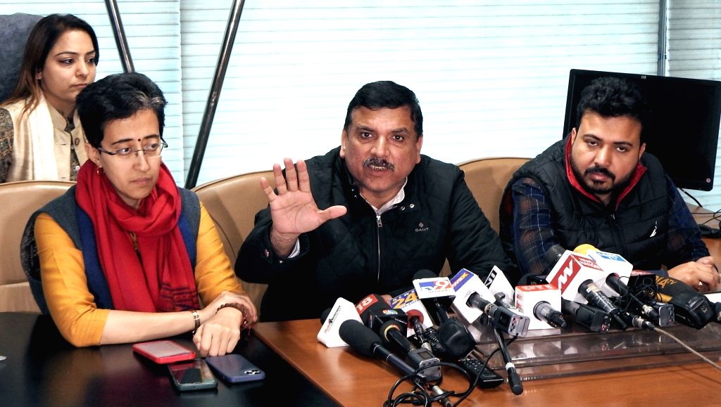 AAP MP Sanjay Singh along with party MLA Atishi Marlena address a press ...