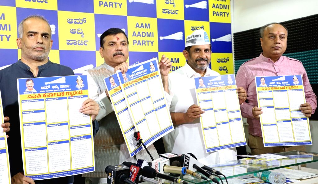 AAP MP Sanjay Singh with party members release AAP Karnataka Guarantee ...