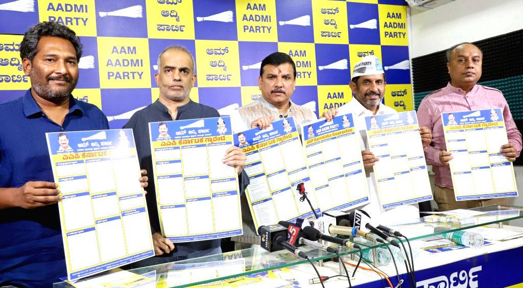 AAP MP Sanjay Singh with party members release AAP Karnataka Guarantee ...