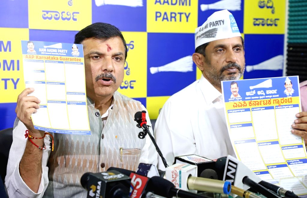 AAP MP Sanjay Singh with party members release AAP Karnataka Guarantee ...
