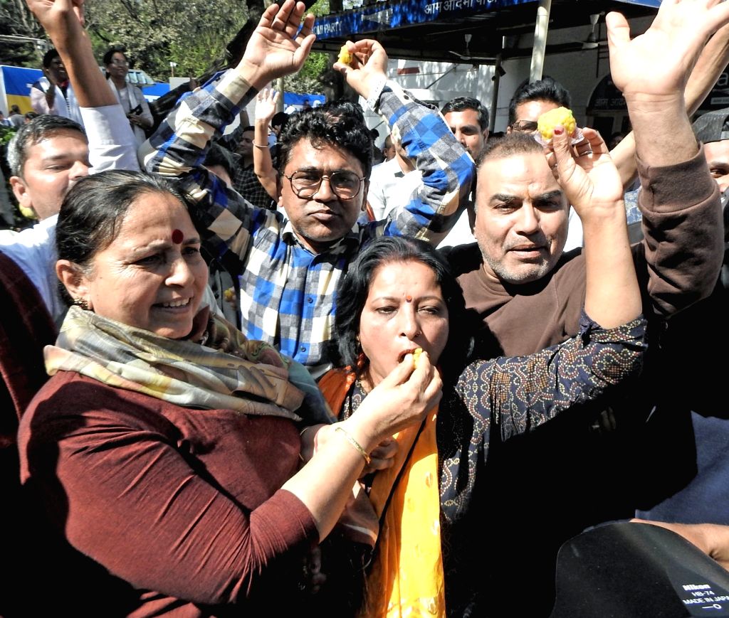 New Delhi: AAP supporters celebrate after the party's winning in Delhi ...