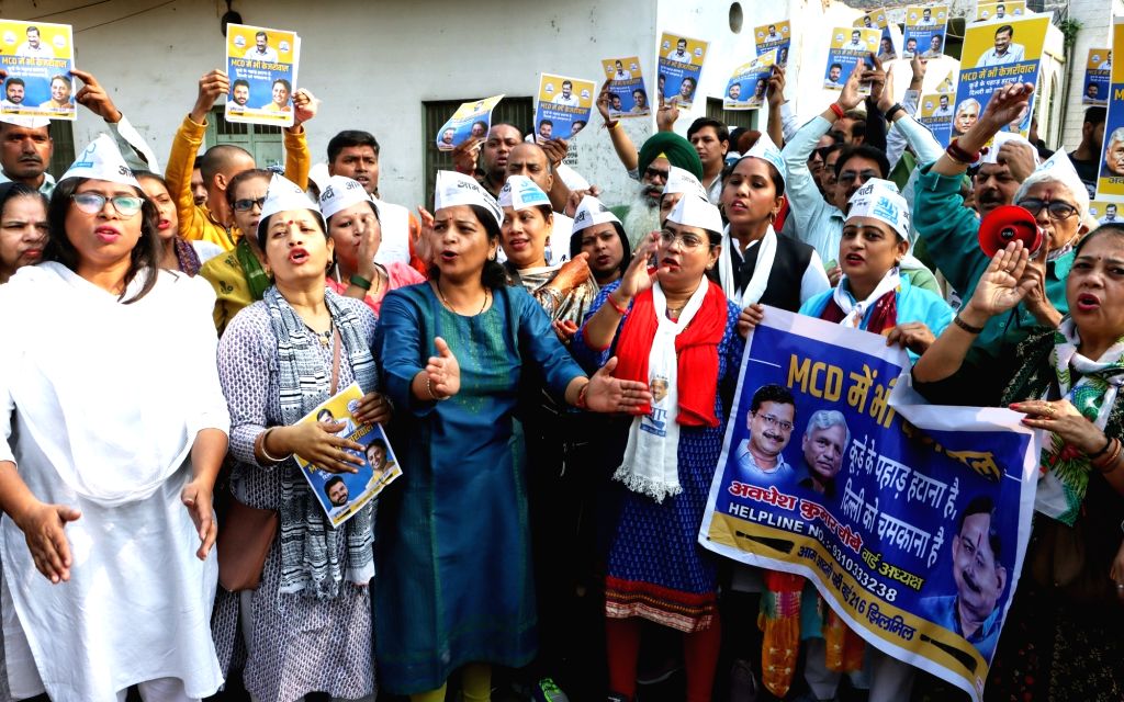 AAP workers shout slogans in support of party leaders ahead of the MCD ...