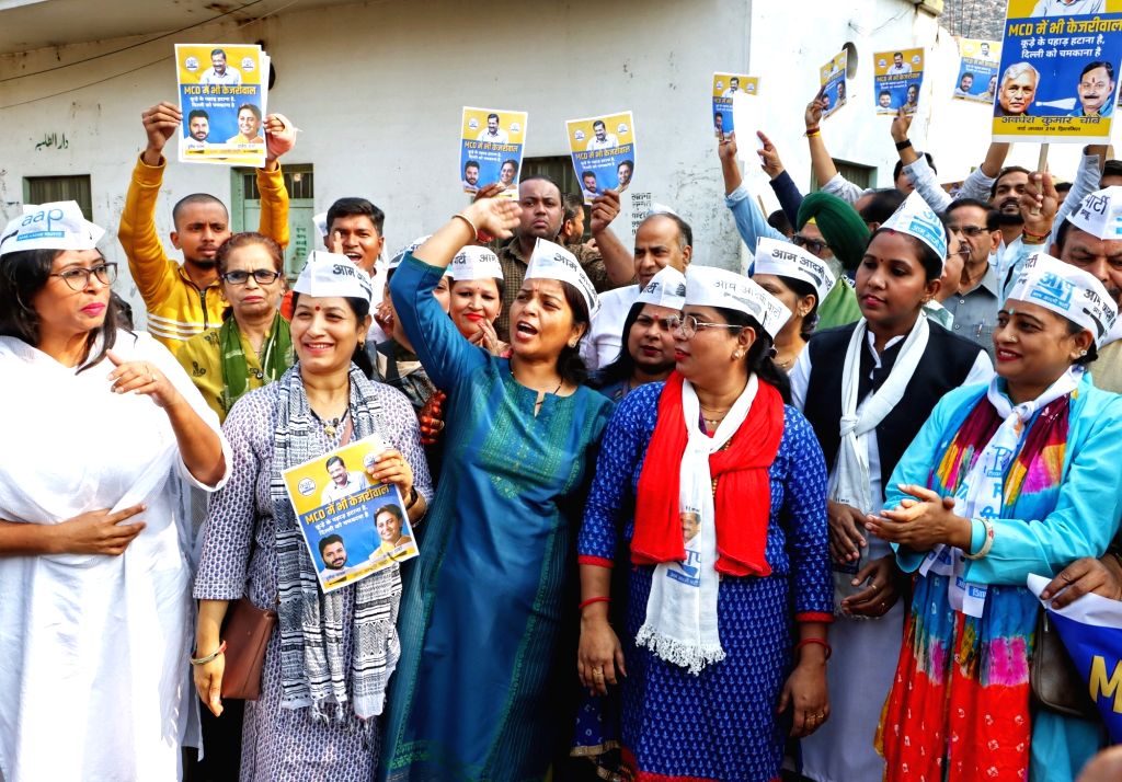 AAP workers shout slogans in support of party leaders ahead of the MCD ...
