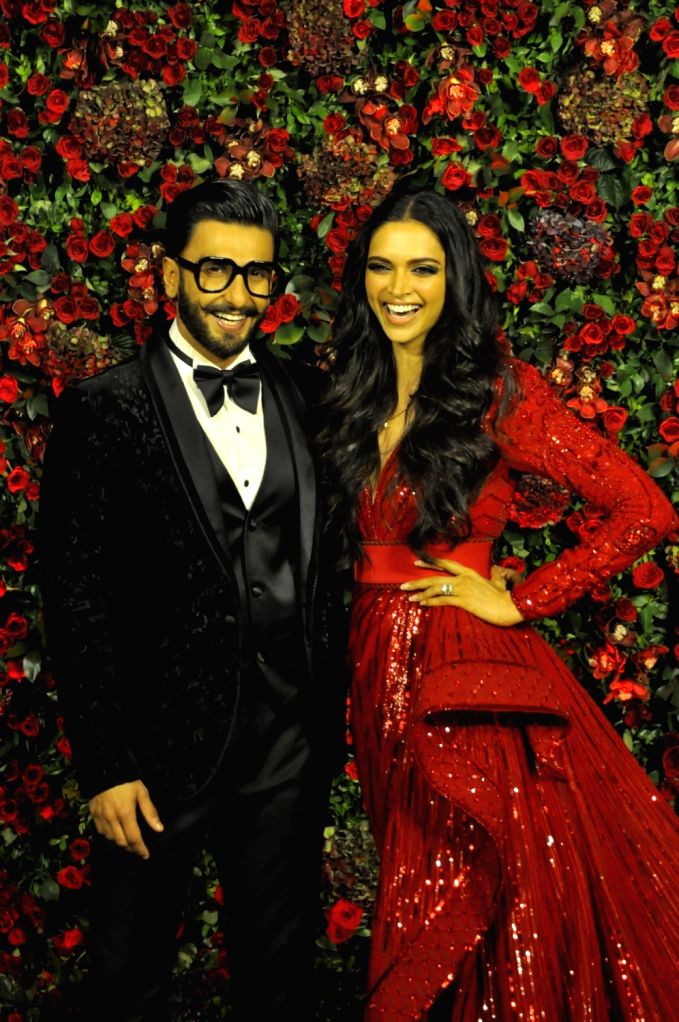 deepika padukone red reception dress Deepika Padukone-Ranveer Singh reception: The couple takes power-dressing to the next level; see pics | Fashion News