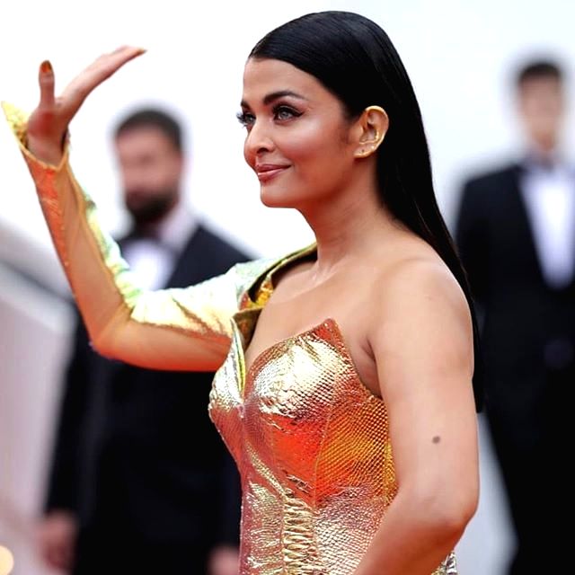 aishwarya rai golden dress Aishwarya Rai Makes Heads Turn In A Gold Gown At Paris Fashion Week 2023, Styles It With Sheer Cape