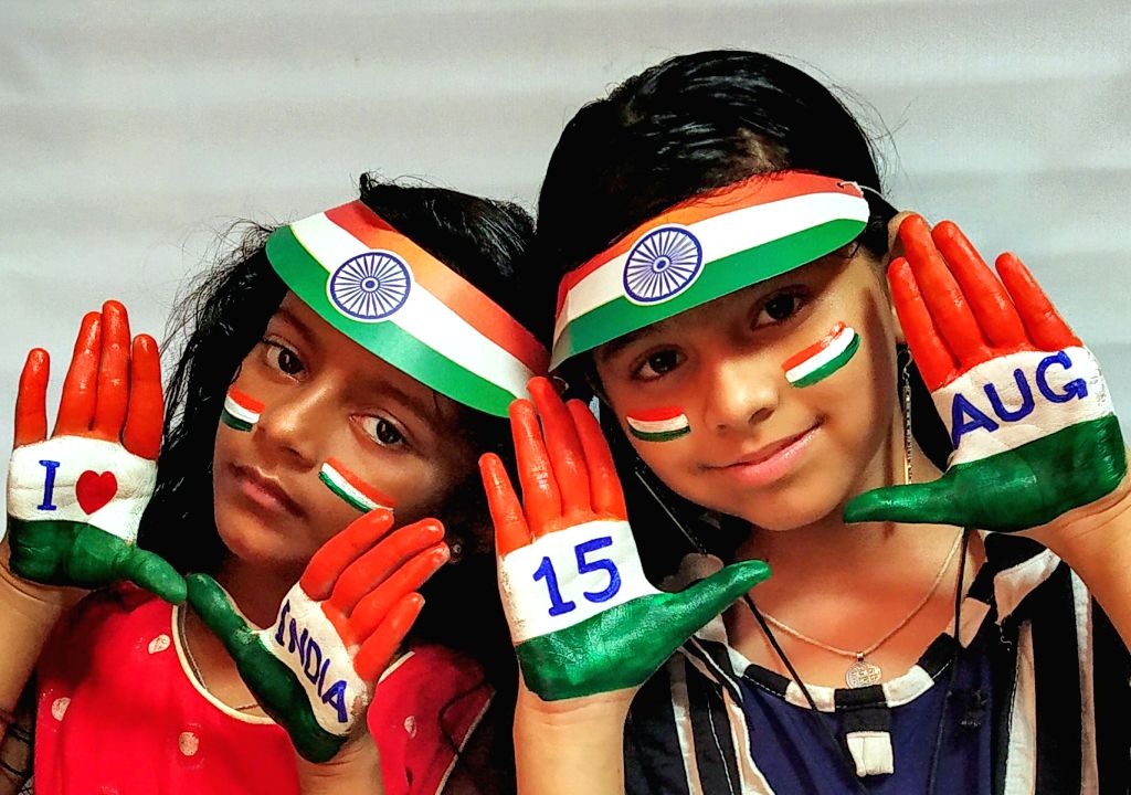 Amritsar : A girl painted their face and hands in the colours of the ...